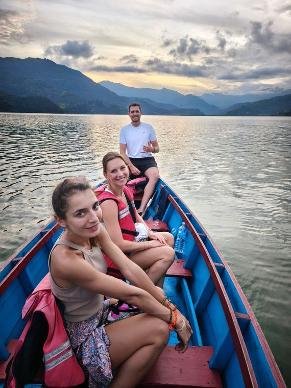 Guests in a rowboat on Phewa Lake