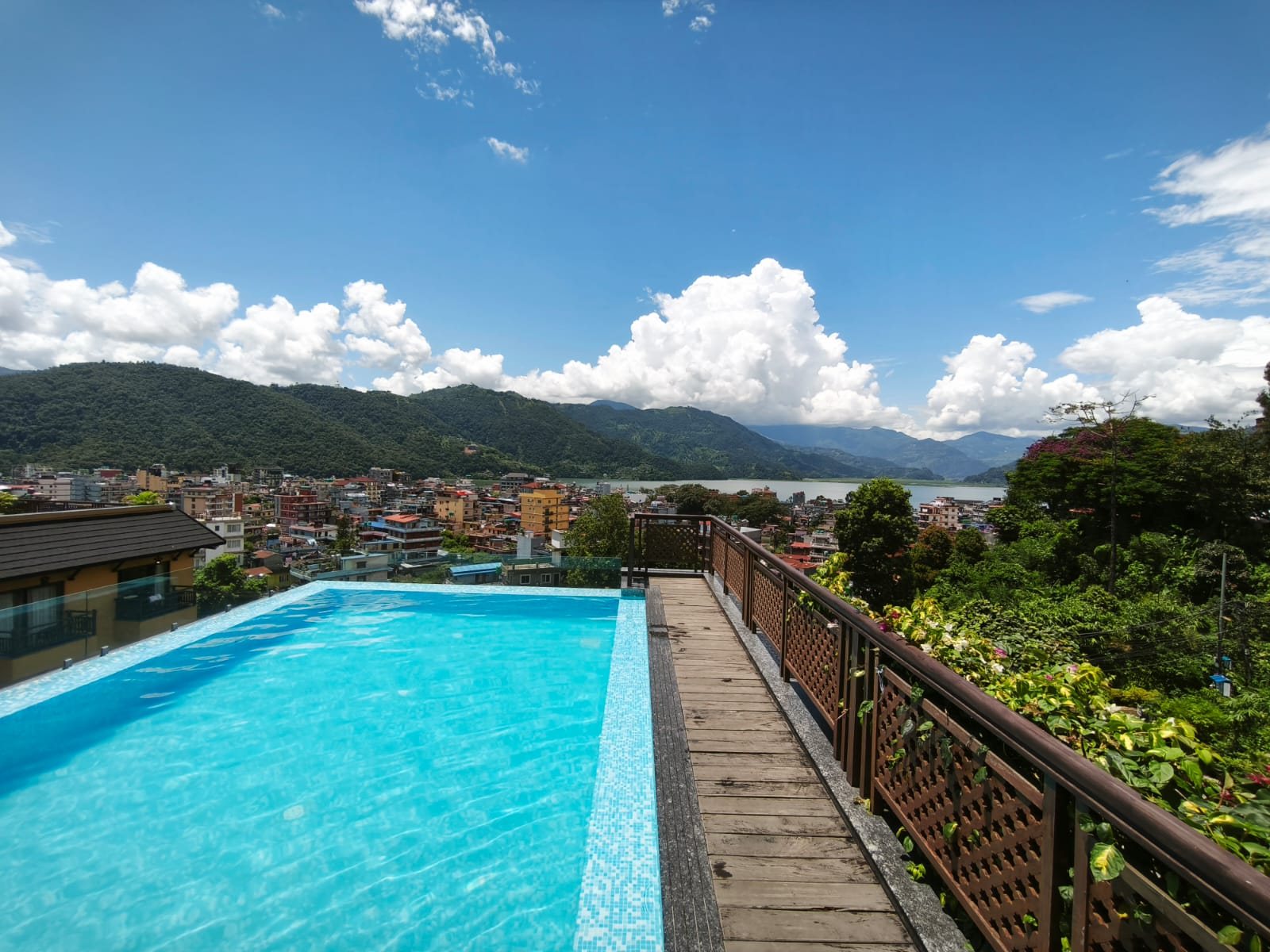Rooftop pool at Nomad Basecamp overlooking the Himalayas Pokhara Nepal